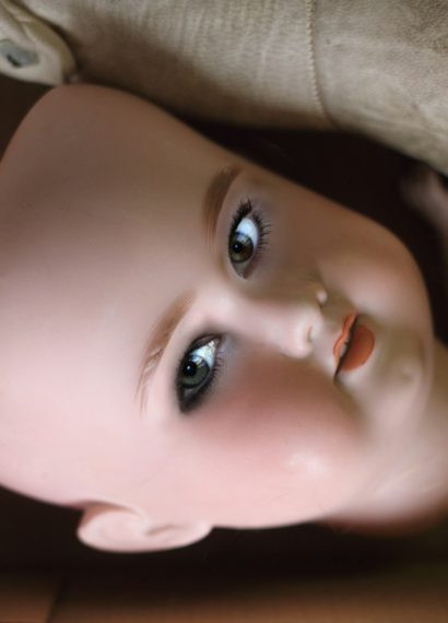 closeup photo of doll face